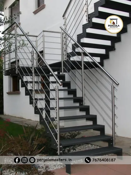 A modern exterior staircase combining a strong black metal frame with sleek stainless steel cable railings. This design offers a contemporary and minimalist aesthetic while ensuring safety and durability.