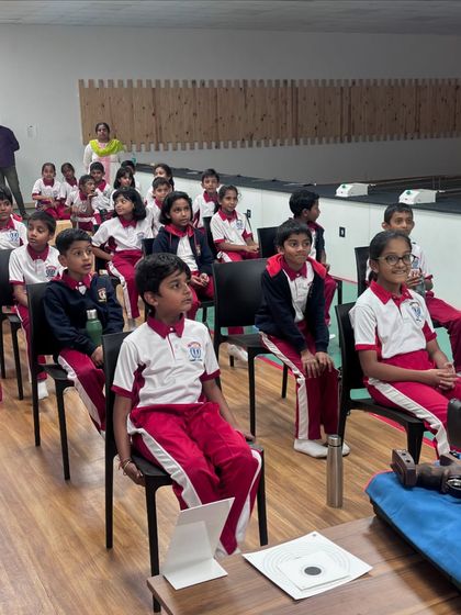 An attentive group of students from Carmel Academy during an introductory session. We begin with the basics of safety and theory before any student handles a weapon, ensuring a strong foundation of knowledge.