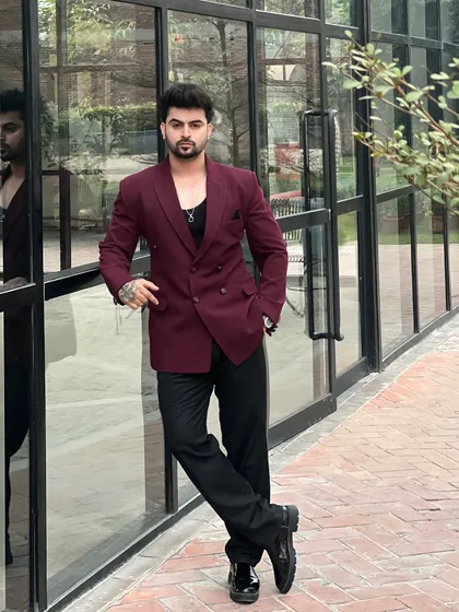 Life's a party, so dress for it. This stylish double-breasted blazer in a rich wine color is perfect for making a statement at any event. We have a range of funky and classic suits for rent.