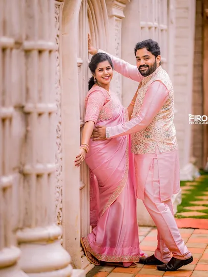 Elegance and tradition are a beautiful combination. This couple chose matching pink traditional outfits for their maternity shoot, and we used the clean, classic architecture of the location to create a timeless and graceful portrait.