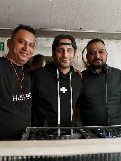 A group photo behind the decks. The DJ booth is the control center of the party, and it's always great to share the space with friends and fellow artists.