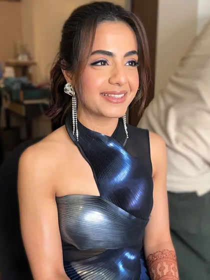 A close-up of her happy face. The ombré liner is the star, but the overall look is balanced with soft, glowing skin and a natural lip.