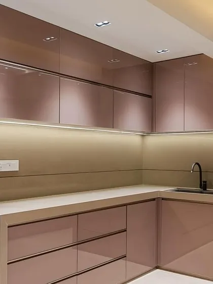 A wide view of the Malad kitchen, showing the refrigerator integrated into the cabinetry for a clean, uniform look.