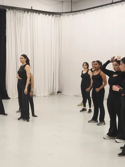 This is where the magic begins. I am guiding a group through a new piece of choreography. My process is all about breaking down the steps and focusing on expression, ensuring everyone feels confident and ready for the performance.