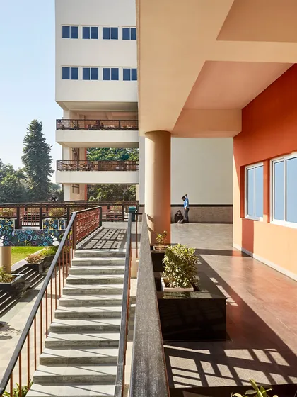 The layered pedestrian system at the Sushant School is inspired by the historic street structure of Shahjahanabad. This image shows the network of covered corridors, stairs, and walkways that create a porous and interconnected campus.