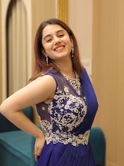 A perfect ready-to-wear saree for all the bridesmaids. This royal blue drape saree with a sheer embroidered back is both elegant and easy to carry.