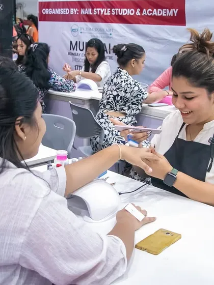 This is me in my element, doing what I love most. Teaching a student during a live competition at the Beautech Expo, focusing on getting the details just right.