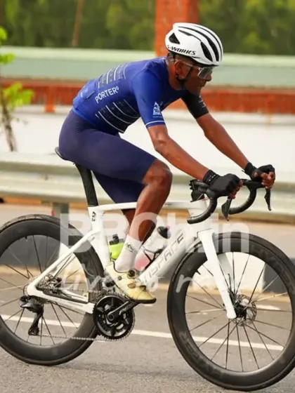 A rider in a solo breakaway, showcasing incredible power and a sleek, aerodynamic setup. This is what it takes to race at the elite level.