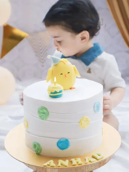 A first birthday is such a precious milestone. I focus on the little details, like the curiosity in a child's eyes as they see their very first birthday cake.