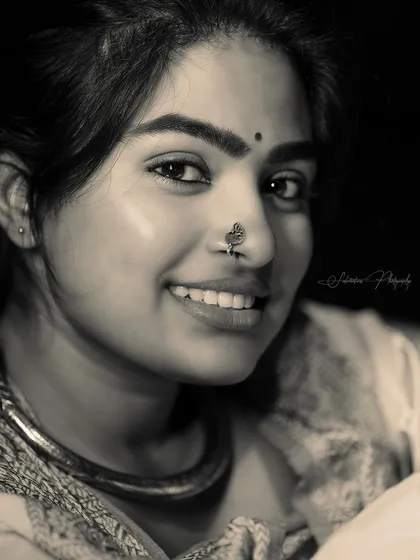 The black and white version of the close-up smile. It highlights the features and the texture of the skin.