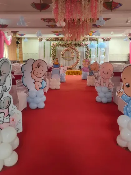 We decorated the entire walkway for this naming ceremony with cute baby-themed cutouts on balloon stands, leading guests to the main stage.