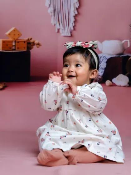 A bundle of joy with a touch of magic. Her happy claps and sweet smile are everything.