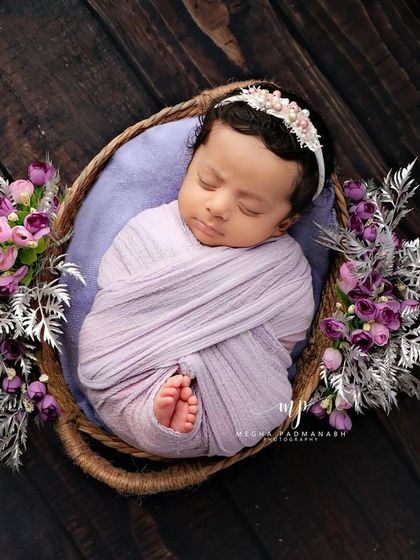 A wider shot that contrasts the dark basket and background with the soft purple wrap.