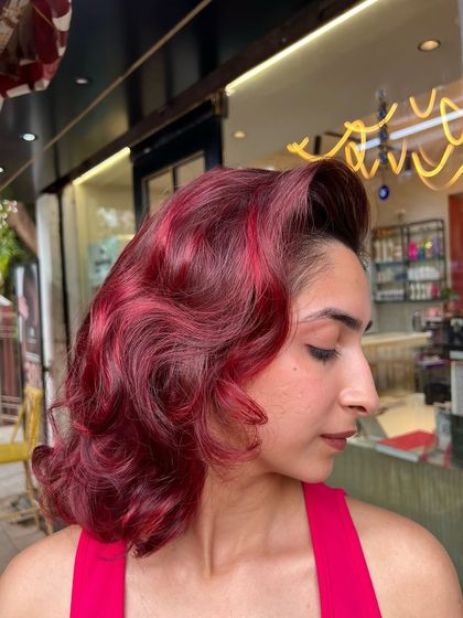 A side profile of the vintage-styled red hair makeover. The deep waves and rich color create a sophisticated and timeless look, proving that red hair can be both bold and elegant.