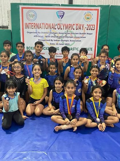 Our team of champions after the District Level competition on World Olympic Day, proudly showing off their medals.