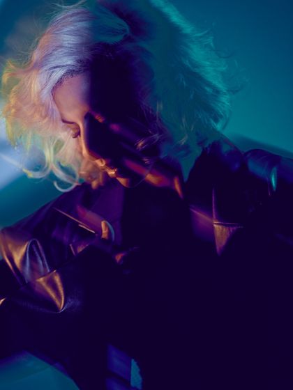 A moody, shadowed portrait from a creative shoot. This captures the darker, more introspective side of my sound.