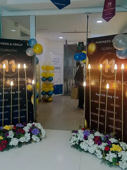 Celebrating a company milestone requires a special touch. I designed and set up these custom standees and entrance decor for a corporate anniversary, highlighting the company's achievement right at the entryway.