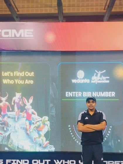At the Vedanta Delhi Half Marathon event, ready to find out my official time. The pre-race excitement is part of the journey.