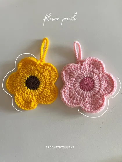My little flower pouches are perfect for keeping small treasures safe. This side-by-side shot shows the sunflower and pink daisy designs. They are great for holding jewelry, lip balm, or even your AirPods.