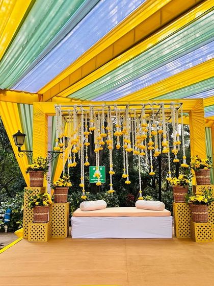 A full view of the yellow-themed Haldi stage, perfect for an outdoor morning ceremony.