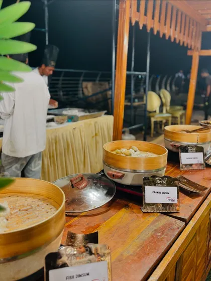 My dim sum station, featuring bamboo steamers and a variety of fillings like fish and prawns, served hot.
