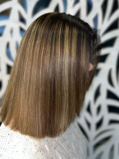 Another angle of the highlighted bob, showing the sleek finish and the beautiful blend of colors.