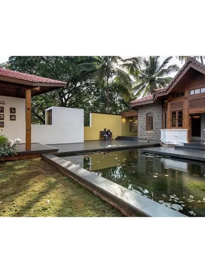 This view captures the essence of the project: the respectful juxtaposition of the restored heritage building with modern pavilions, all unified by a thoughtfully designed landscape.