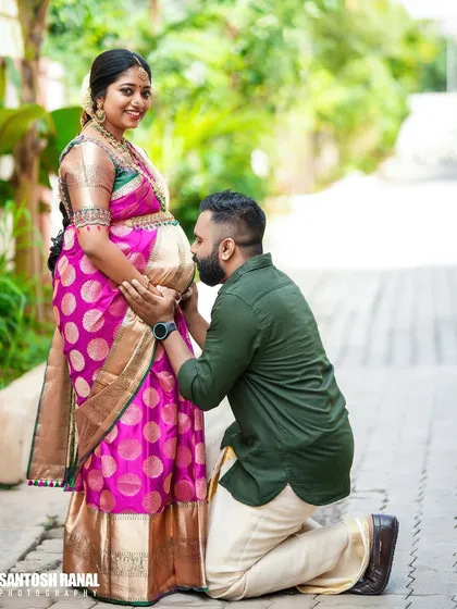 A tender moment during a traditional baby shower ceremony. We focus on capturing these quiet, unscripted interactions, like a father-to-be expressing his love, which make for truly timeless photographs.