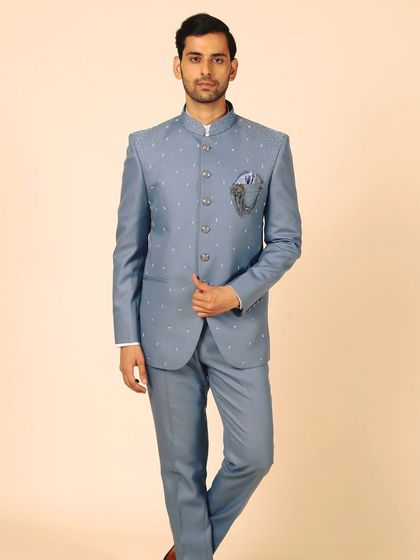 A classic Bandhgala in pastel blue with delicate bead and pearl embroidery. This suit is tailor-made to your fit, offering a look that is both seasonal and sophisticated.