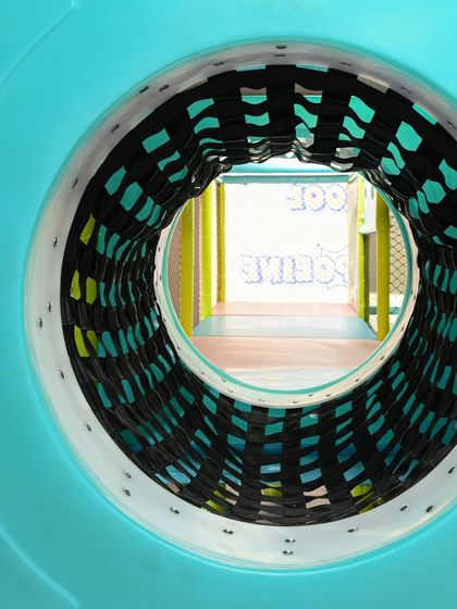 A view through one of our crawl tunnels. These connect different parts of the multi-level maze, encouraging exploration and adventure.