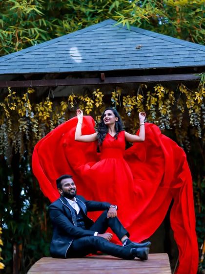 This dramatic pre-wedding photo showcases the beautiful heart-shape effect that can be created with my red flying gown. It's a perfect shot for a romantic couple.