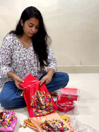Here I am, sitting on the floor of my home workshop, carefully packing Ganpati return gifts. This was for a large order of 200 potli bags, and it was a moment of pure joy and gratitude for me.
