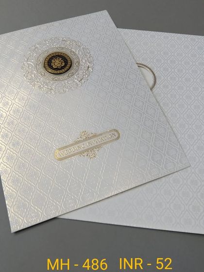 This white invitation features a textured background and a simple gold nameplate. The design is clean, modern, and budget-friendly.