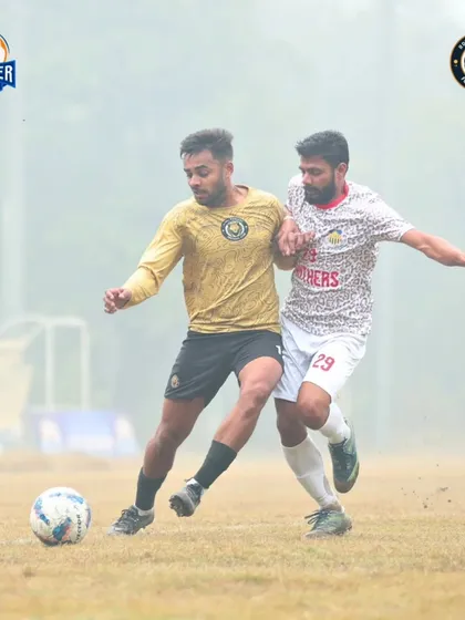 A physical battle for possession, showing the strength and determination required to win midfield duels.