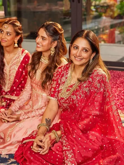 A heartwarming moment between the bride and her mother. My outfits are designed to be a part of these precious family moments.
