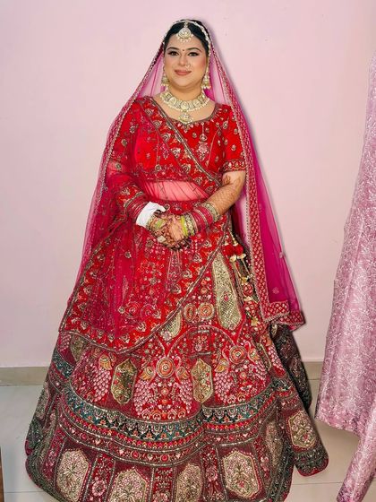 A full-length shot of the bride, showing the entire ensemble and how the makeup complements it.
