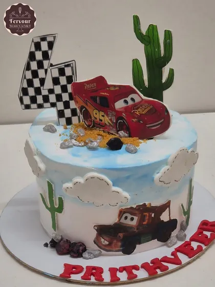 A McQueen car theme cake from the movie "Cars". This chocolate mousse cake features Lightning McQueen and Mater in a desert scene.