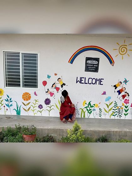 We had so much fun beautifying the walls of Ikshana Patashala, a preschool. We painted several murals, including a welcome wall with kids and flowers, and a large "tree of knowledge" doodle, to create a playful and inspiring environment.