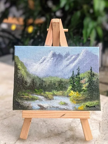 I find so much peace in painting the pahad (mountains). This miniature landscape shows a quiet stream flowing from snow capped mountains. I focused on the layers of the forest and the movement of the water on this 3x4 inch canvas.