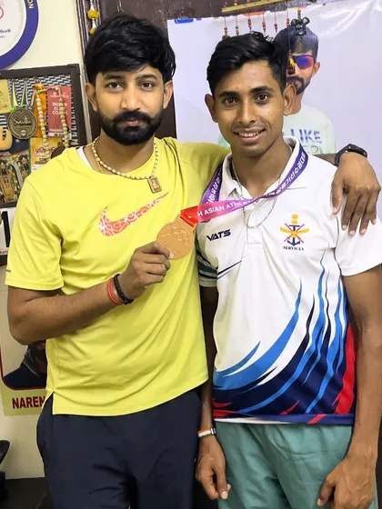 Celebrating a champion's success. Here I am with one of my dedicated athletes after he secured a major win. Moments like these are what our shared journey of hard work and perseverance is all about.