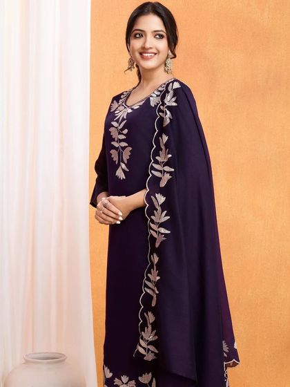 A wine-colored vichitra silk kurta with beautiful silver thread embroidery. The leaf motifs give it a unique, nature-inspired touch.