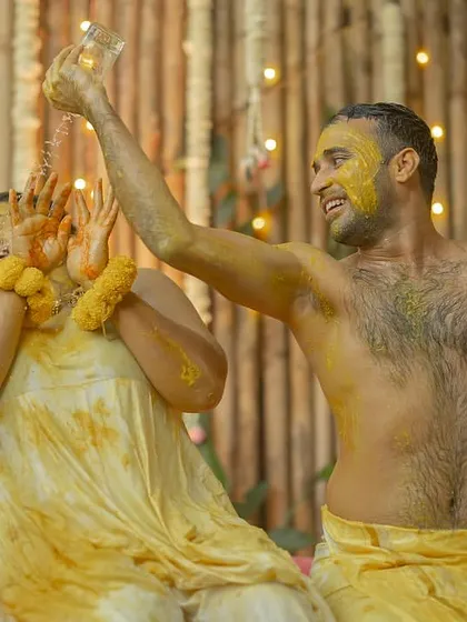 Haldi ceremonies are meant to be messy, fun, and full of laughter. I love getting right in the middle of the action to capture the pure, uninhibited joy of the moment, just like this splash-filled scene from a Goa wedding.