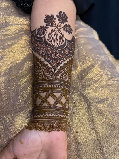 Another angle of the forearm cuff design, highlighting the intricate details.