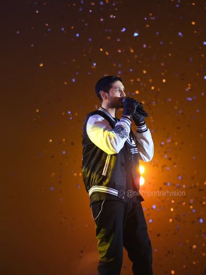 A different perspective of Arjun Kanungo's performance, with confetti falling like stars. This shot captures the magic of the moment from a wider angle.
