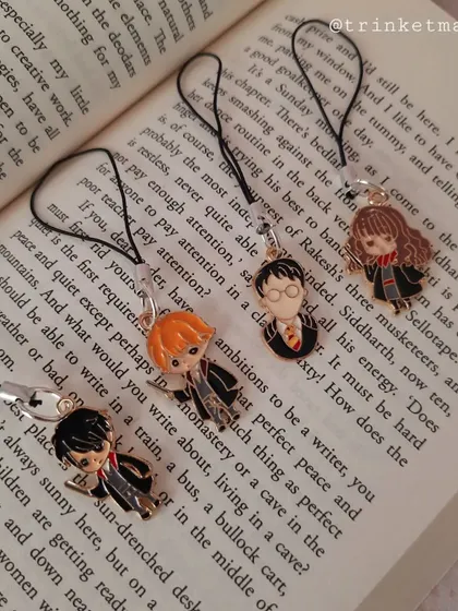 A different angle of my Harry Potter phone charms, showing the trio of Harry, Ron, and Hermione ready to be attached to your phone or bag.
