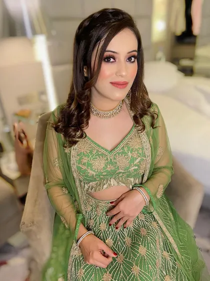 A soft yet glamorous look for this beauty in green. I used warm, earthy tones on her eyes and a nude lip to create a look that is both elegant and modern.