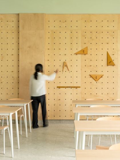 An interactive pegboard wall in the math lab allows for hands-on learning. Teachers and students can use oversized geometric tools to demonstrate concepts in a tangible and engaging way.