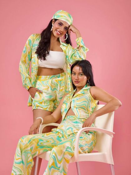 Another coordinated look from the Raki Designs shoot. The makeup is bright and youthful, with a pop of color on the lips to match the fun, swirly prints.