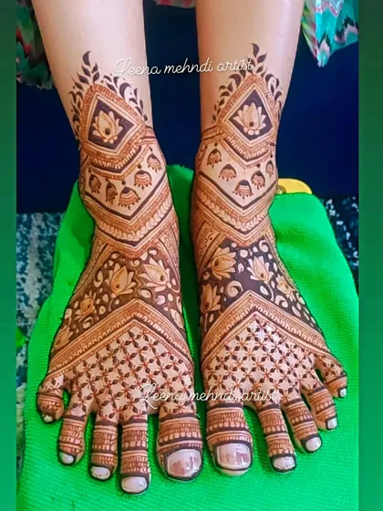 A full-coverage geometric foot design. The pattern features repeating diamond shapes filled with lotuses, extending from the toes up to the ankle for a very modern and chic look.