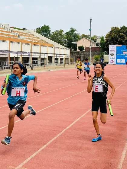 Achieving big dreams. Our talented athletes dash to victory in a relay race.